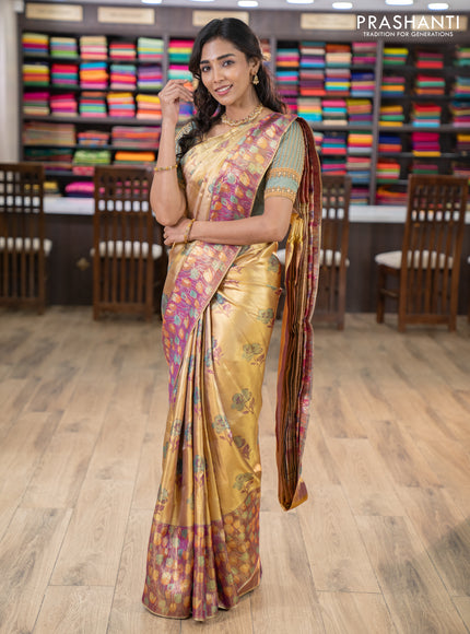Pure kanchipuram tissue silk saree gold and dual shade of purple with floral design motif and long rich floral design border