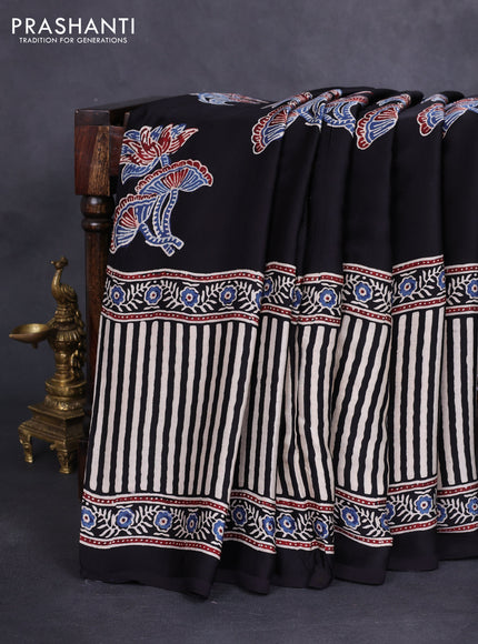 Modal silk saree black with ajrakh butta prints and printed border