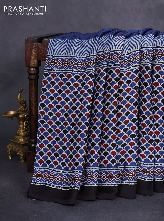 Modal silk saree blue and black with allover ajrakh prints and printed border