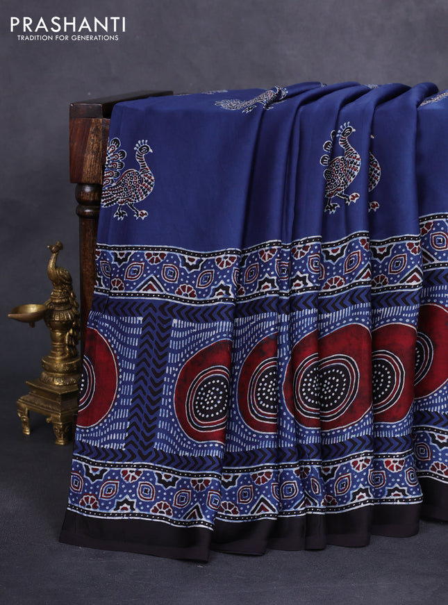 Modal silk saree blue and black with allover ajrakh prints and printed border
