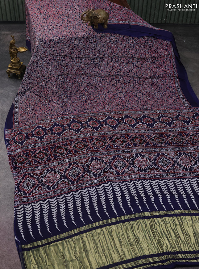 Modal silk saree blue with allover ajrakh prints and simple border