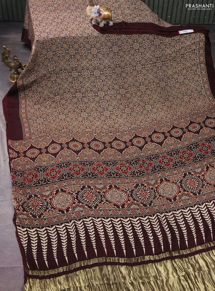 Modal silk saree coffee brown with allover ajrakh prints and simple border