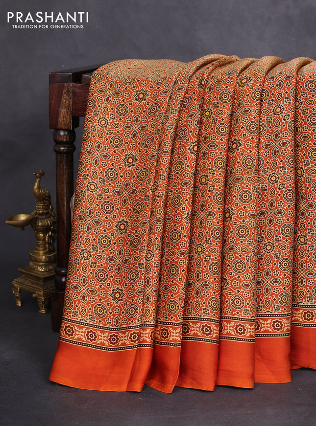 Modal silk saree orange with allover ajrakh prints and simple border