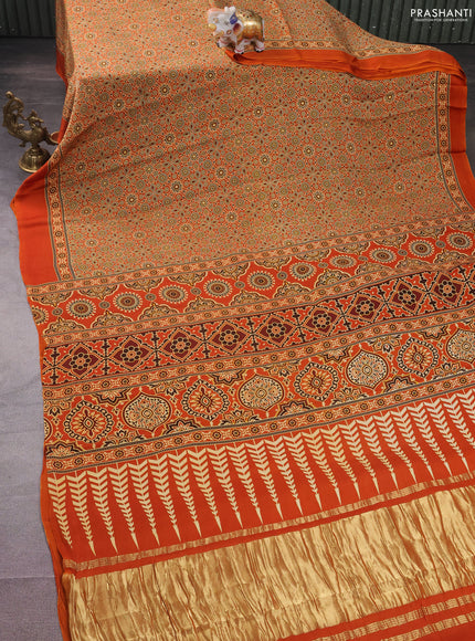 Modal silk saree orange with allover ajrakh prints and simple border