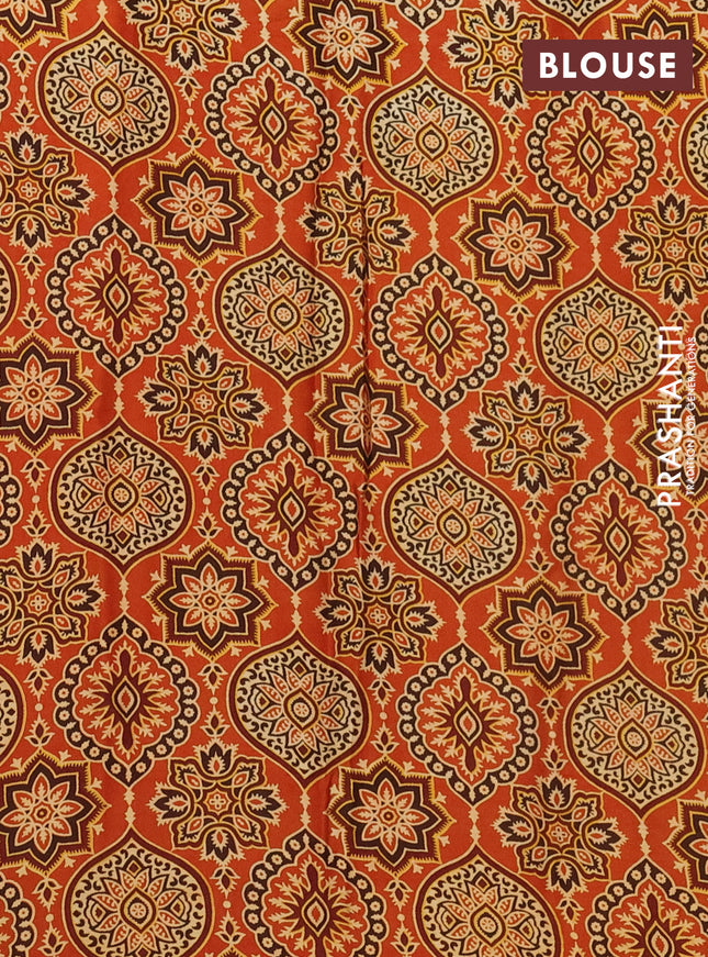 Modal silk saree orange with allover ajrakh prints and simple border