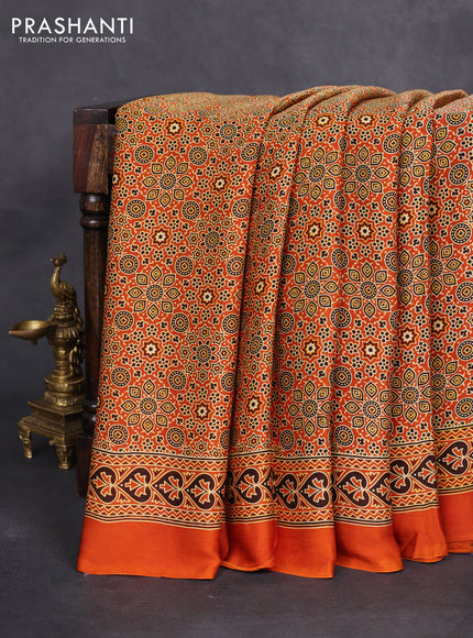 Modal silk saree orange with allover ajrakh prints and printed border