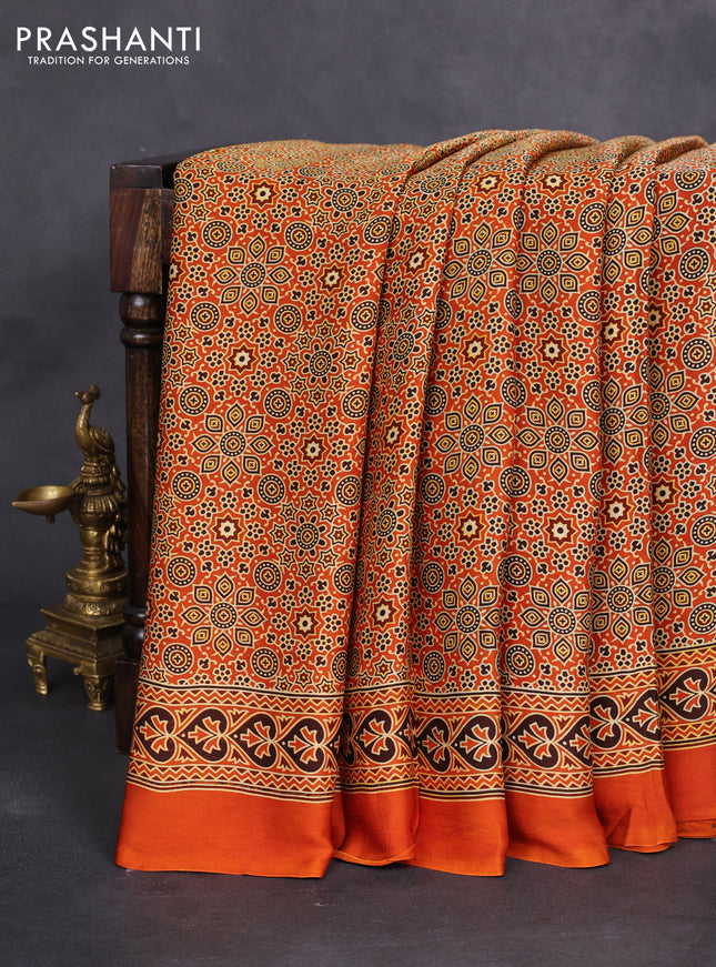 Modal silk saree orange with allover ajrakh prints and printed border