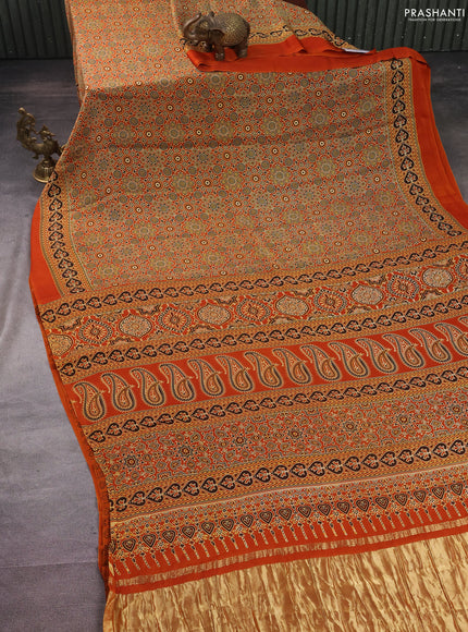 Modal silk saree orange with allover ajrakh prints and printed border