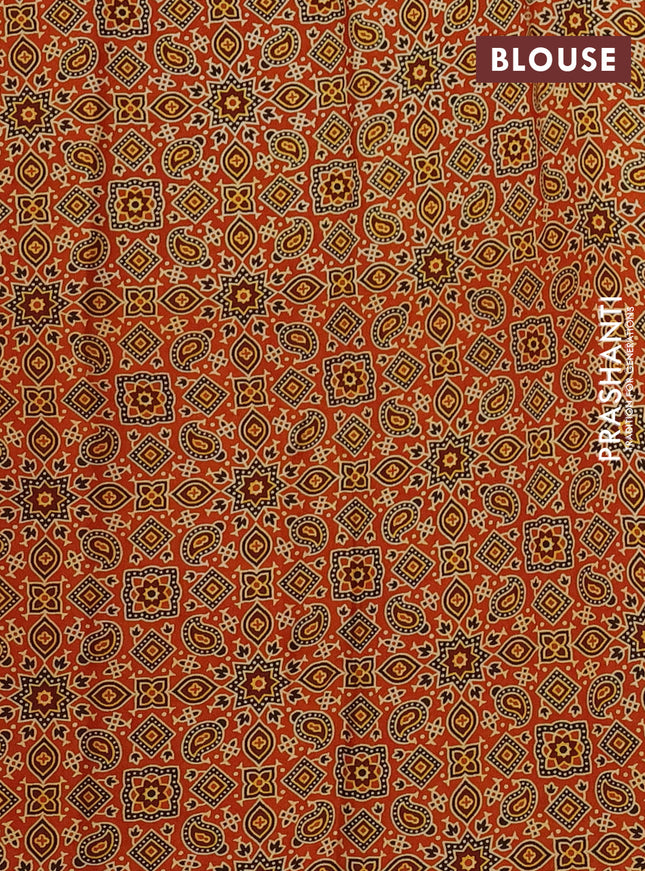 Modal silk saree orange with allover ajrakh prints and printed border