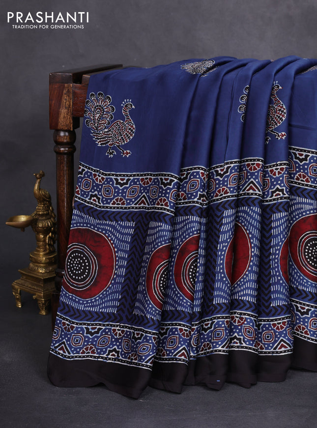 Modal silk saree blue and black with ajrakh butta prints and printed border