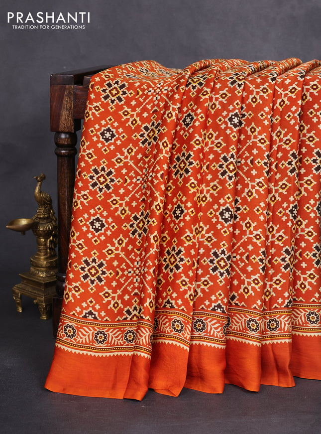 Modal silk saree orange with allover ajrakh prints and printed border