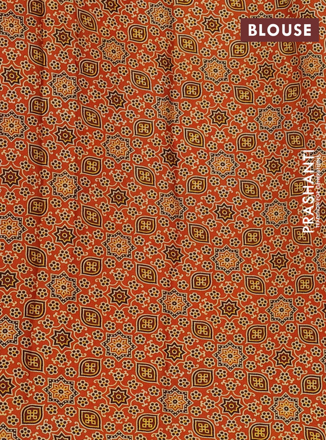 Modal silk saree orange with allover ajrakh prints and printed border