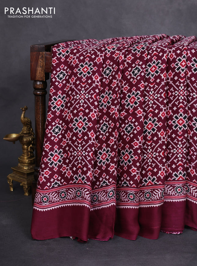 Modal silk saree wine shade with allover ajrakh prints and printed border