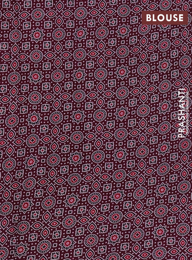 Modal silk saree wine shade with allover ajrakh prints and printed border