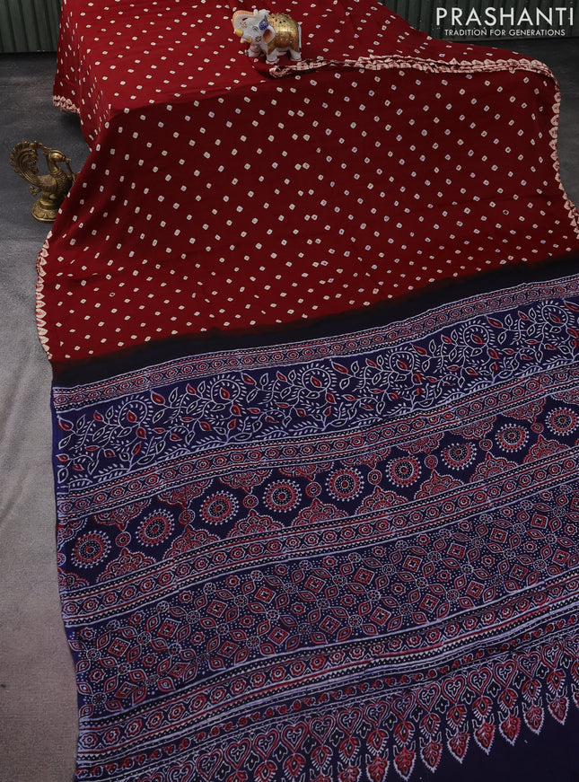Modal silk saree maroon and navy blue with allover bandhini prints and ajrakh printed pallu & blouse