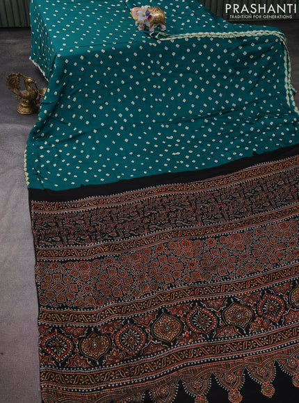 Modal silk saree green and black with allover bandhini prints and ajrakh printed pallu & blouse