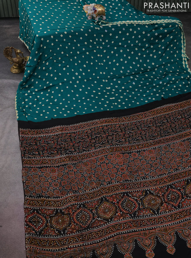 Modal silk saree green and black with allover bandhini prints and ajrakh printed pallu & blouse