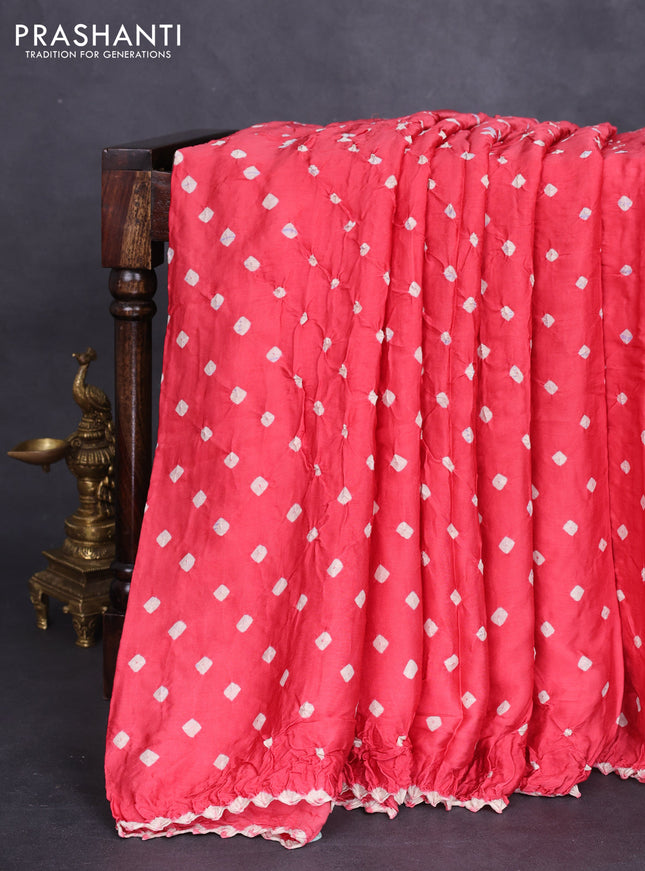 Modal silk saree peach shade and navy blue with allover bandhini prints and ajrakh printed pallu & blouse