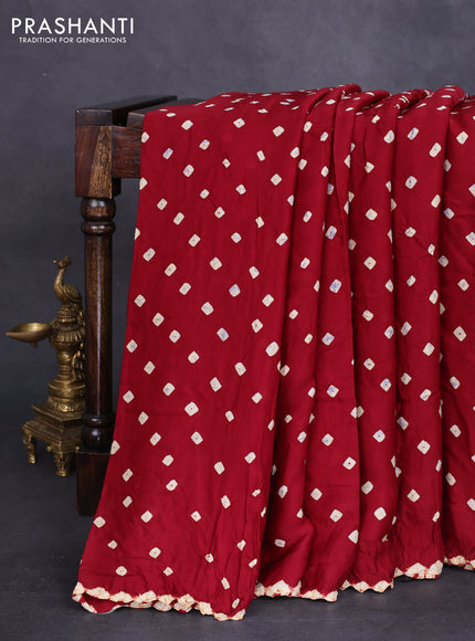 Modal silk saree maroon and black with allover bandhini prints and ajrakh printed pallu & blouse