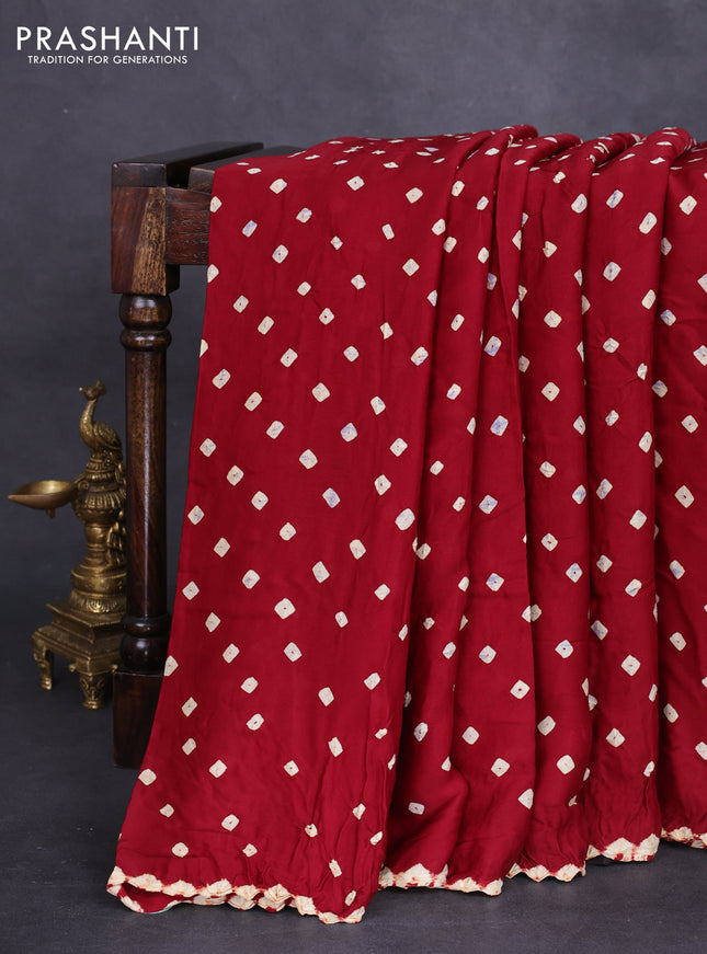 Modal silk saree maroon and black with allover bandhini prints and ajrakh printed pallu & blouse