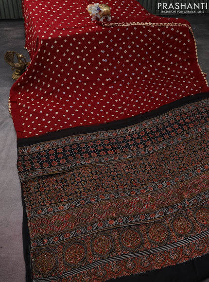 Modal silk saree maroon and black with allover bandhini prints and ajrakh printed pallu & blouse