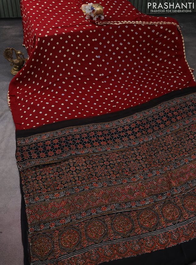 Modal silk saree maroon and black with allover bandhini prints and ajrakh printed pallu & blouse
