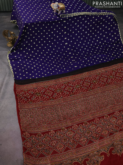 Modal silk saree blue and maroon with allover bandhini prints and ajrakh printed pallu & blouse
