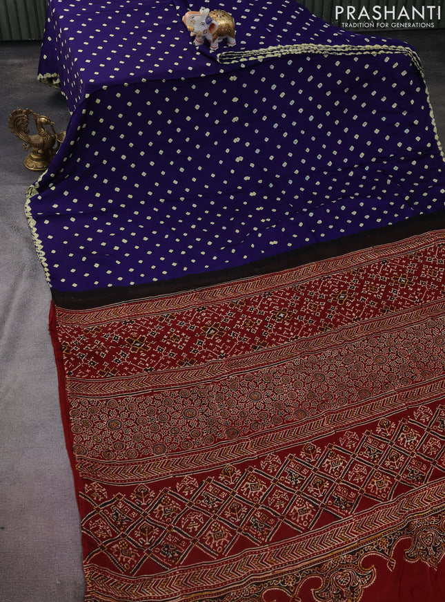 Modal silk saree blue and maroon with allover bandhini prints and ajrakh printed pallu & blouse