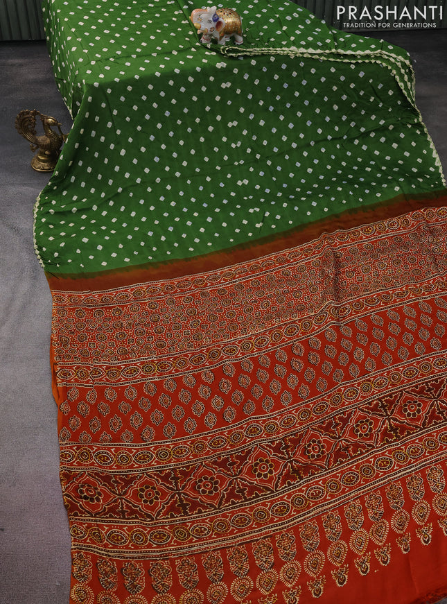 Modal silk saree mehendi green and orange with allover bandhini prints and ajrakh printed pallu & blouse