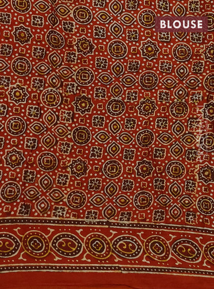 Modal silk saree mehendi green and orange with allover bandhini prints and ajrakh printed pallu & blouse