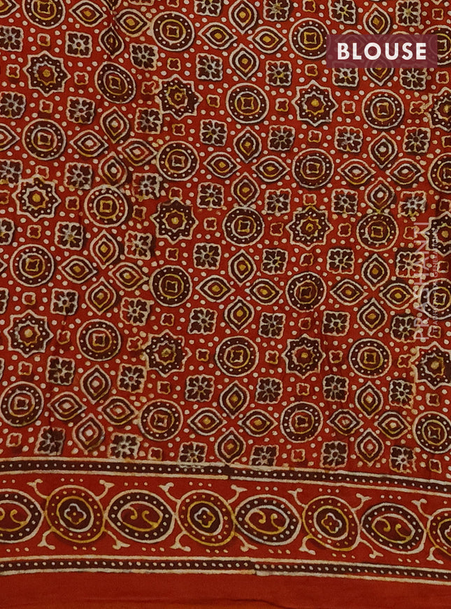 Modal silk saree mehendi green and orange with allover bandhini prints and ajrakh printed pallu & blouse