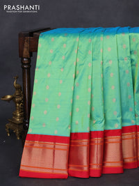 Pure paithani silk saree dual shade of teal green and red with allover zari woven floral buttas and paithani weaving pallu