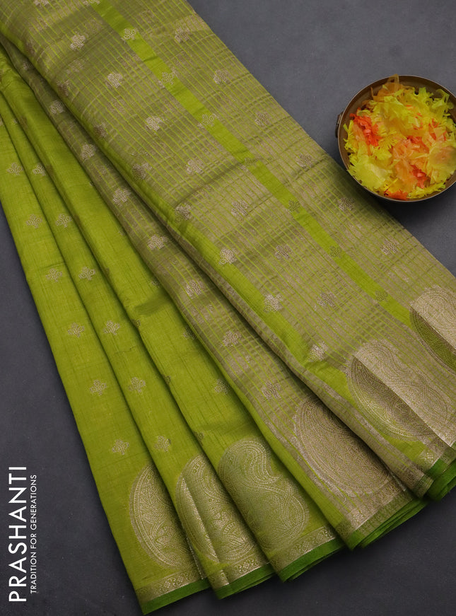Semi raw silk saree lime green with allover zari woven 1000 buttas and paisley zari woven butta border