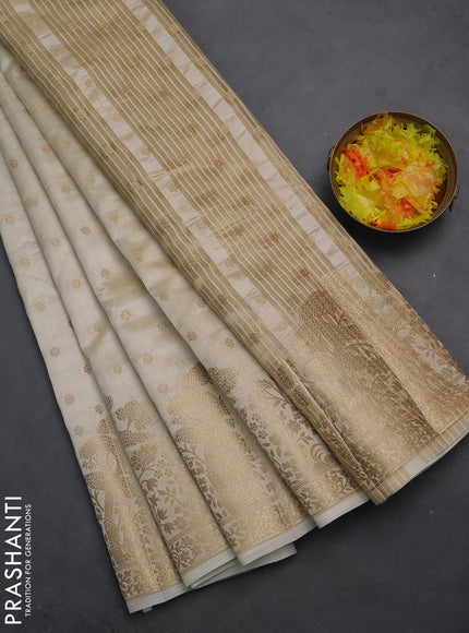Semi raw silk saree cream with allover zari woven 1000 buttas and zari woven border