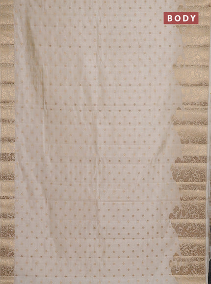 Semi raw silk saree cream with allover zari woven 1000 buttas and zari woven border