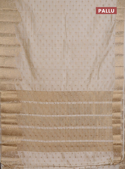 Semi raw silk saree cream with allover zari woven 1000 buttas and zari woven border