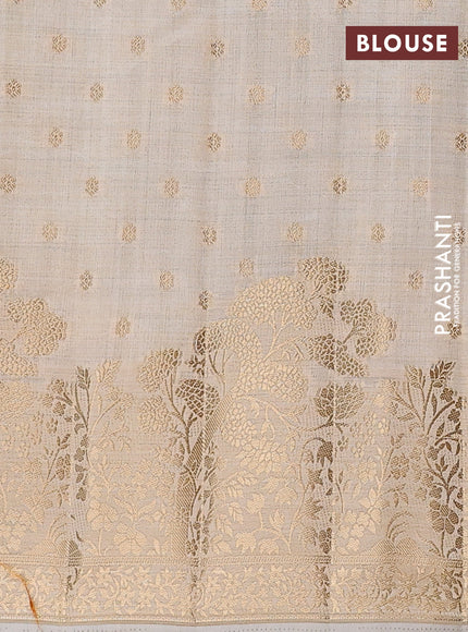 Semi raw silk saree cream with allover zari woven 1000 buttas and zari woven border