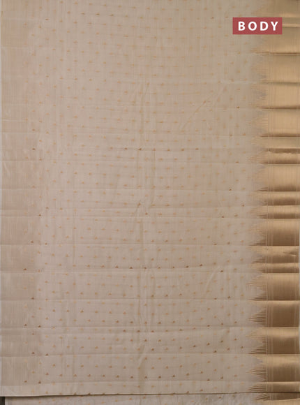 Semi raw silk saree cream with allover zari woven 1000 buttas and temple design zari woven border