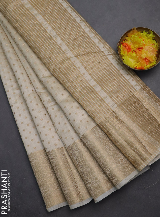 Semi raw silk saree cream with allover zari woven 1000 buttas and rich zari woven border