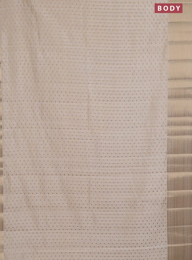 Semi raw silk saree cream with allover zari woven 1000 buttas and rich zari woven border