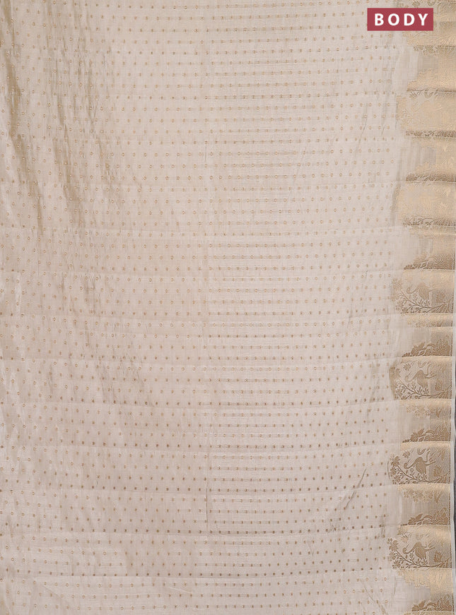 Semi raw silk saree cream with allover zari woven 1000 buttas and rich zari woven border