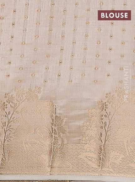 Semi raw silk saree cream with allover zari woven 1000 buttas and rich zari woven border