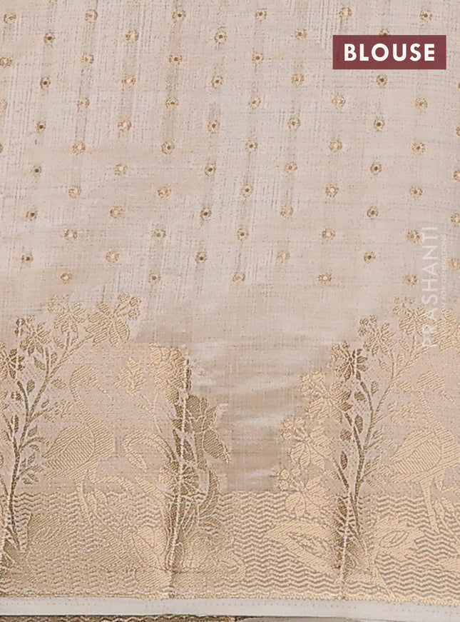 Semi raw silk saree cream with allover zari woven 1000 buttas and rich zari woven border