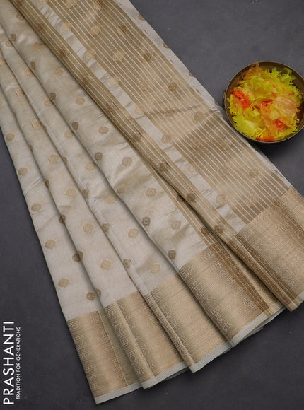Semi raw silk saree cream with allover zari woven 1000 buttas and zari woven border