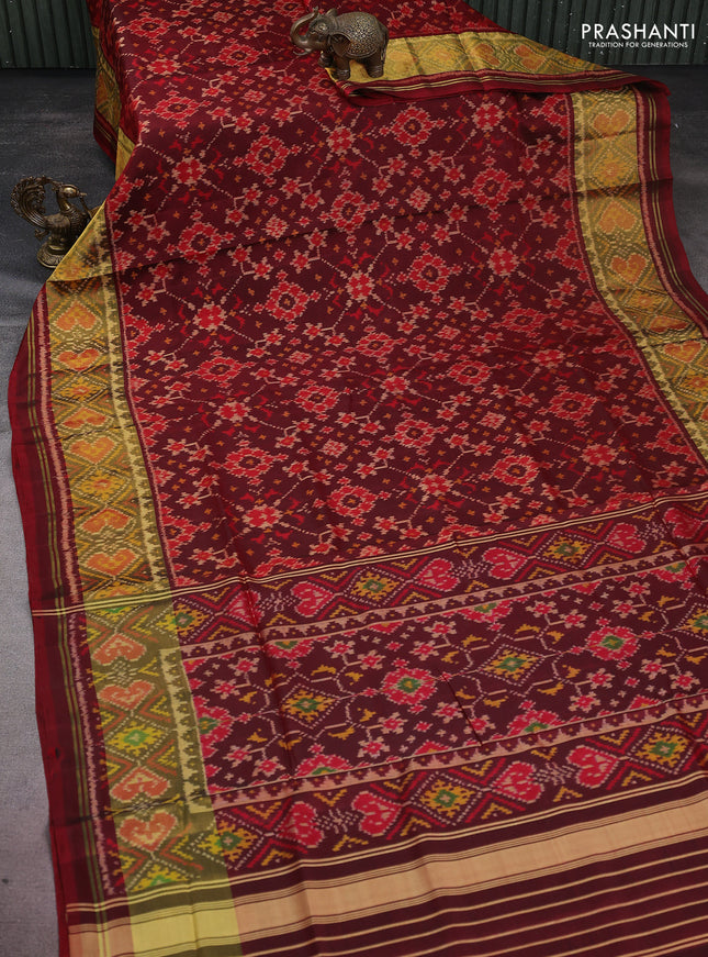 Rajkot patola silk saree deep maroon with allover ikat weaves and long zari woven border