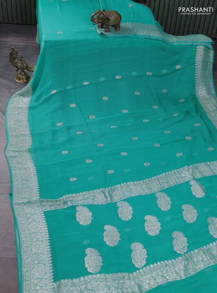 Banarasi chiffon silk saree teal blue with silver zari woven buttas and silver zari woven border