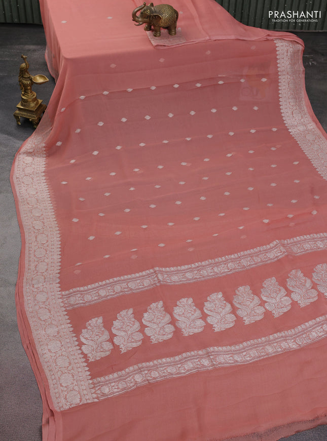 Banarasi chiffon silk saree pastel peach with silver zari woven buttas and floral silver zari woven border