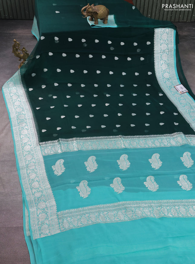 Banarasi chiffon silk saree bottle green and teal blue with silver zari woven buttas and silver zari woven border