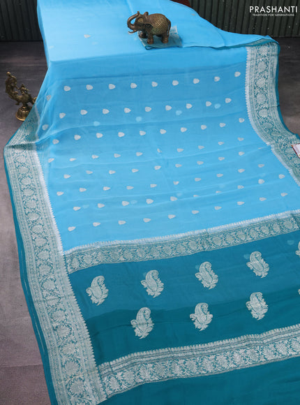 Banarasi chiffon silk saree light blue and teal green with silver zari woven buttas and silver zari woven border