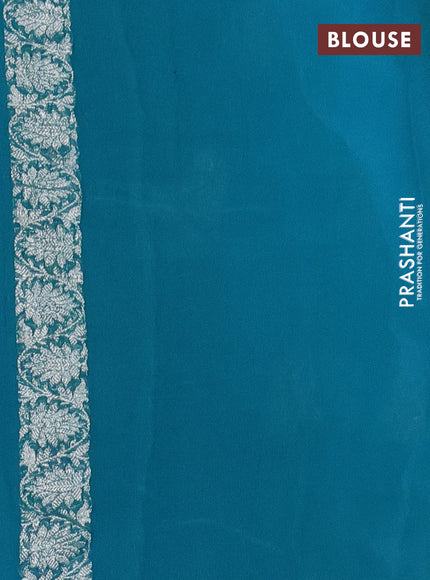 Banarasi chiffon silk saree light blue and teal green with silver zari woven buttas and silver zari woven border